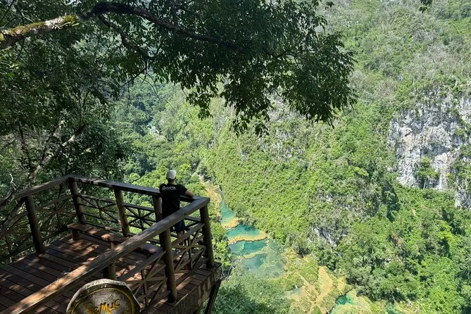 Panoramic view of the turquoise pools and limestone bridge at Semuc Champey from the El Mirador viewpoint, full-day tour from Guatemala City